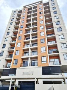 a tall apartment building with the name juliani at Exclusivo mono para 4 personas in Luque