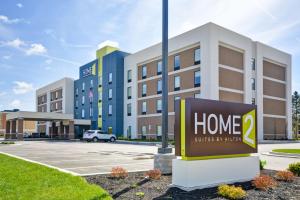 a sign in front of a home surprise hotel at Home2 Suites By Hilton Evansville in Evansville