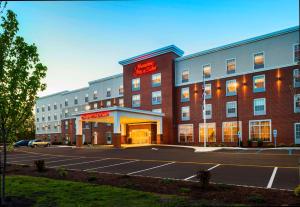 a hotel with a parking lot in front of it at Hampton Inn & Suites Bridgewater, NJ in Bridgewater