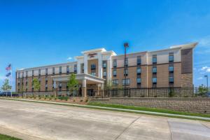 a large office building with a street in front of it at Hampton Inn-St. Louis Wentzville, MO in Wentzville