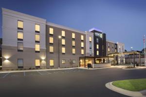 an empty parking lot in front of a building at Home2 Suites By Hilton Oxford in Oxford