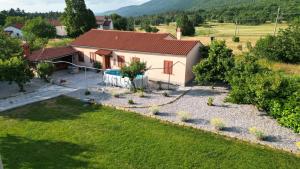 an aerial view of a house with a garden at Hiša Pod Slavnikom in Podgorje