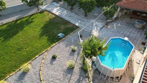 an overhead view of a yard with a swimming pool at Hiša Pod Slavnikom in Podgorje