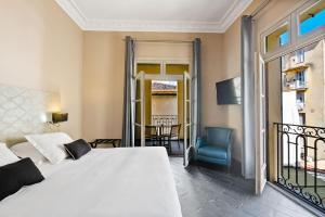 Rúm í herbergi á Hotel POZZO DI BORGO