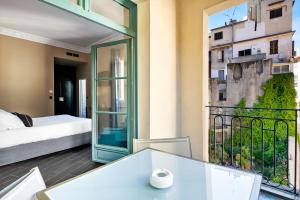 Rúm í herbergi á Hotel POZZO DI BORGO