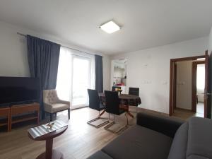 a living room with a couch and a table at Dubrovnik Apartment Nepe in Dubrovnik