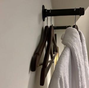 a pair of towels hanging on a rack in a bathroom at Glenesk No 1 , Woodhall Spa in Lincolnshire