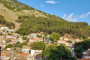 a town on a hill with a mountain at 4 Season Cozy Home in Samothraki