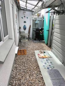 a walkway in a house with a gravel floor at Sea Shells in Torquay