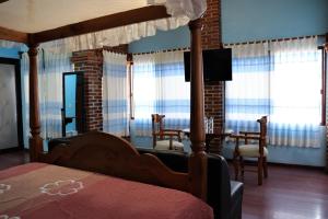 Postel nebo postele na pokoji v ubytování Hotel Zaragoza