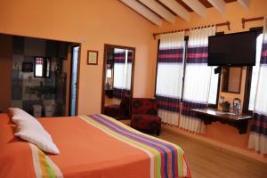 Postel nebo postele na pokoji v ubytování Hotel Zaragoza