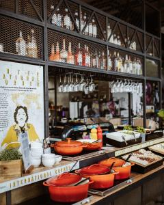 a display of food on a counter in a restaurant at Emma by Schulz Hotel Berlin Friedrichshain in Berlin