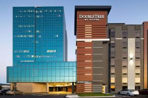 a building with a doozy tree sign on top of it at DoubleTree By Hilton Halifax Dartmouth in Halifax