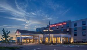 a hospital building with a sign on top of it at Hilton Garden Inn Pittsburgh Airport in Moon Township