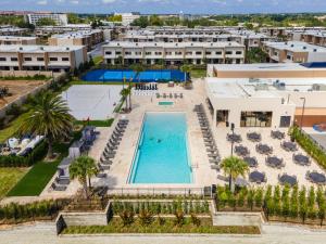 an aerial view of the pool at the resort at 7564 Magic Village luxury jacuzzi bbq 6min Disney & 192 in Orlando