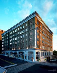 a rendering of a large brick building on a street at The Virginian Lynchburg, Curio Collection By Hilton in Lynchburg