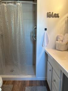 a bathroom with a shower with a glass door at Area 3251 Desert Valley Guest Suite in Pahrump +8 photos