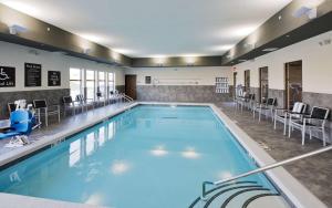 a large swimming pool in a hotel room at Homewood Suites By Hilton Topeka in Topeka