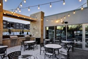 an outdoor patio with tables and chairs and lights at Home2 Suites By Hilton Mt. Juliet, Tn in Mount Juliet