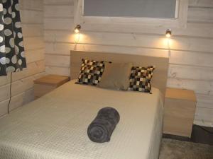 a headboard of a bed in a bedroom at Holiday Villa Kerimaa 18 in Savonlinna