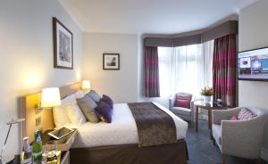 Postel nebo postele na pokoji v ubytování Thistle London Bloomsbury Park