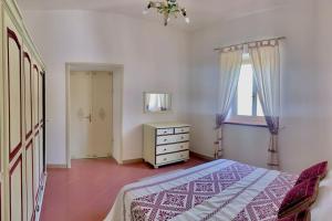 Ένα ή περισσότερα κρεβάτια σε δωμάτιο στο Casa vacanze Nuraghe Orosei