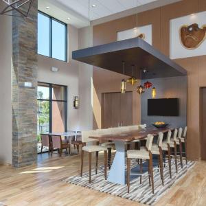 a dining room with a large table and chairs at Hampton Inn & Suites Murrieta Temecula in Murrieta