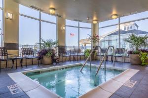 a swimming pool in the lobby of a hotel at Hilton Garden Inn Salina in Salina