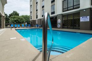 a swimming pool in front of a building at Hampton Inn & Suites Wilson I-95 in Wilson