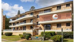 a building with a sign in front of it at Breakers 3 - linen not included in Forster