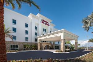 a rendering of the front of a hotel at Hampton Inn & Suites West Melbourne-Palm Bay Road in Melbourne