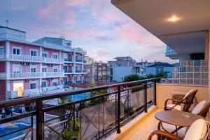 a balcony with a view of a city at Limenaria Beach in Limenaria