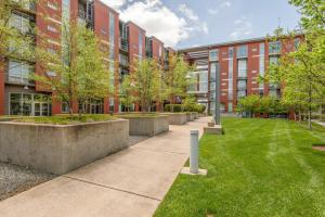 a courtyard in front of a brick building at Sleek and Spacious Condo In East! in Nashville