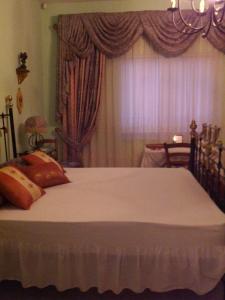 Llit o llits en una habitació de Merzuq House
