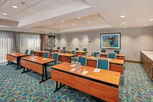 a conference room with wooden tables and chairs at Hampton Inn & Suites Sacramento at CSUS in Sacramento +57 photos