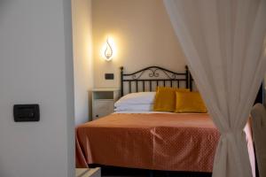 En eller flere senge i et værelse på Antelima B&B