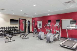 a gym with several treadmills and exercise machines at Home2 Suites By Hilton Louisville Airport Expo Center in Louisville
