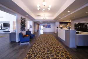 a lobby with a waiting room and a reception desk at Hampton Inn & Suites Forest City in Forest City