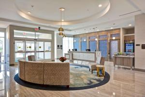 a lobby of a hotel with a reception desk at Homewood Suites by Hilton Conroe in Conroe