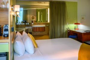 Cama ou camas em um quarto em Ohtel Wellington
