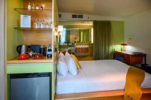 Cama ou camas em um quarto em Ohtel Wellington