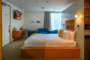Cama ou camas em um quarto em Ohtel Wellington