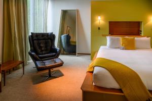 Cama ou camas em um quarto em Ohtel Wellington
