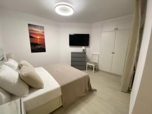 Postel nebo postele na pokoji v ubytování Apartaments L’ARC