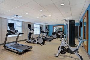 a gym with several exercise bikes in a room at Homewood Suites By Hilton Savannah Airport in Savannah