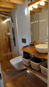 a bathroom with a sink and a toilet and a mirror at I Loft Viana in Viana do Castelo +43 photos