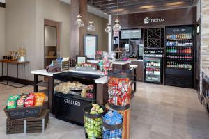a grocery store with a counter with food and drinks at Hilton Garden Inn Waco in Waco