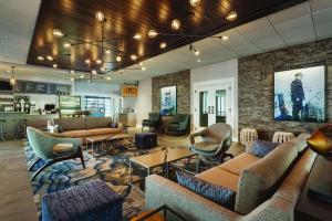 a lobby with couches and chairs in a building at Hotel Ballast Wilmington, Tapestry Collection by Hilton in Wilmington