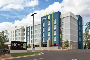 a building with a home sign in front of it at Home2 Suites By Hilton Columbia Harbison in Columbia