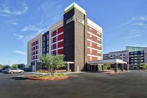 a hotel with a parking lot in front of it at Home2 Suites by Hilton Gilbert in Gilbert